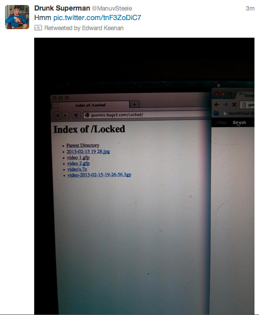 A screenshot of a @ManuvSteele tweet that says "Hmm" and includes a photo of a computer screen showing the index of a "Locked" directory on goonies.bugs3.com. It contains two gfp files, marked "video 1" and "video 2."